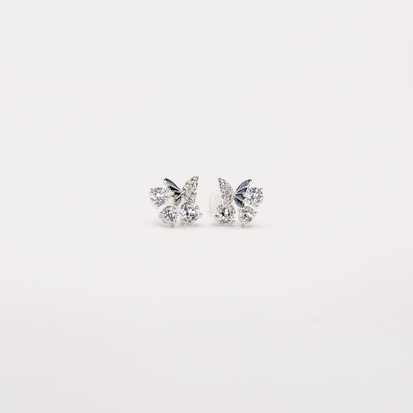 Broqueles plateados de mariposa con zirconias circulares