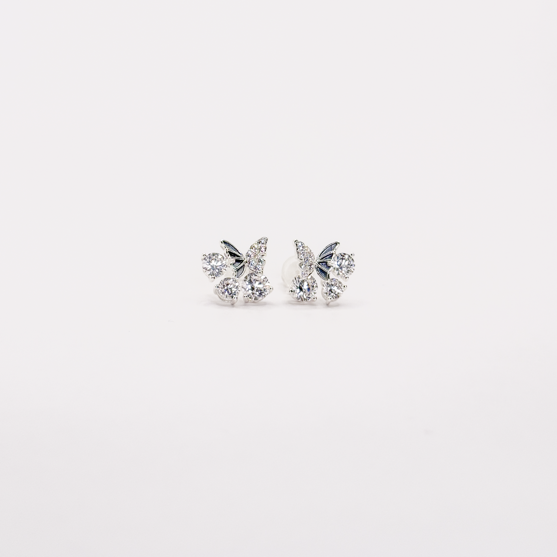 Broqueles plateados de mariposa con zirconias circulares
